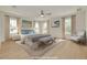 This staged main bedroom is bright with lots of natural light and warm decor at 323 Appian Ne Way, St Petersburg, FL 33704