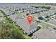 Aerial view of townhomes in a neighborhood with tree lined streets and lush green spaces at 3818 Cat Mint St, Tampa, FL 33619