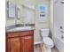Cozy bathroom featuring a vanity with granite countertop, tiled floors, and a bathtub with shower at 3818 Cat Mint St, Tampa, FL 33619