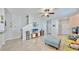 Relaxing living room features a comfy blue ottoman and entertainment center, promoting relaxation at 3818 Cat Mint St, Tampa, FL 33619
