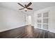 Spacious bedroom features dark wood floors, ceiling fan, and sliding door closet at 7218 Park S St, St Petersburg, FL 33707