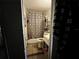 Small bathroom with a shower-tub combination and basic fixtures visible from doorway at 8302 N Lois Ave, Tampa, FL 33614