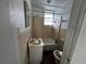 Compact bathroom with a tub, shower and sink, ready for renovation at 8302 N Lois Ave, Tampa, FL 33614