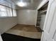 Modest bedroom features a window with blinds and a closet with built-in shelving at 8302 N Lois Ave, Tampa, FL 33614