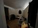 Compact bedroom with tile flooring, minimal natural light, and personal items stored at 8302 N Lois Ave, Tampa, FL 33614