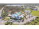 This aerial view of the resort-style community features tennis courts, a pool, a clubhouse and other amenities at 12312 Bay Estuary Bnd, Riverview, FL 33579