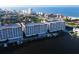Condo building overlooking the harbor and beach with stunning waterfront views and boat slips, aerial shot at 17717 Gulf Blvd # 601, Redington Shores, FL 33708