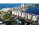Aerial view of condo complex with multiple units, parking, landscaping, and proximity to the beach and waterway at 17717 Gulf Blvd # 601, Redington Shores, FL 33708