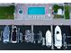 Aerial view of a community pool, hot tub, and boat docks with multiple vessels at 17717 Gulf Blvd # 601, Redington Shores, FL 33708