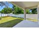 A covered patio looking out to a lawn and a privacy fence at 3218 21St N St, St Petersburg, FL 33713