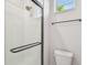Modern bathroom featuring a glass shower with white subway tile and stylish black fixtures at 3218 21St N St, St Petersburg, FL 33713