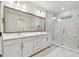 Bathroom featuring marble floors and a double vanity at 3218 21St N St, St Petersburg, FL 33713
