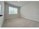 Cozy bedroom with carpeting, window and neutral colored walls at 3218 21St N St, St Petersburg, FL 33713