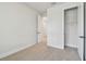 A bright bedroom with plush neutral carpet, white walls, and a spacious closet with ample storage space at 3218 21St N St, St Petersburg, FL 33713