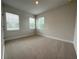 Bright bedroom with carpeting and multiple windows for natural light at 3218 21St N St, St Petersburg, FL 33713