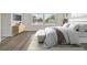 Serene bedroom with natural light, wooden floors, stylish furniture, and a calming ambiance at 3218 21St N St, St Petersburg, FL 33713