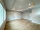 Large bedroom with hardwood floors, tray ceiling, and recessed lighting at 3218 21St N St, St Petersburg, FL 33713