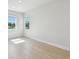 Bright bedroom with two windows and wood-look floors at 3218 21St N St, St Petersburg, FL 33713