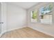 Bright bedroom with hardwood floors, two windows, and stylish white trim at 3218 21St N St, St Petersburg, FL 33713