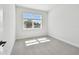 Bright bedroom featuring neutral carpet, white walls, and large windows offering great natural light at 3218 21St N St, St Petersburg, FL 33713