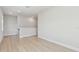 Hallway with wood-look floors and white trim at 3218 21St N St, St Petersburg, FL 33713