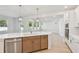 Modern kitchen with a large island, stainless steel appliances, eat-in area, and lots of natural light from large windows at 3218 21St N St, St Petersburg, FL 33713