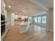 Bright open kitchen with quartz island, stainless steel appliances and view to living area at 3218 21St N St, St Petersburg, FL 33713