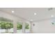 Bright living room with hardwood floors and three large windows that provide lots of natural light from the outside at 3218 21St N St, St Petersburg, FL 33713