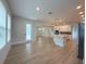 Open concept living area with plank flooring, bright lighting and access to the lanai at 3218 21St N St, St Petersburg, FL 33713