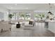 Open living room with bright windows, modern decor, and seamless flow to the kitchen at 3218 21St N St, St Petersburg, FL 33713