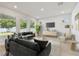 Bright living room featuring recessed lighting, multiple windows, and neutral-colored furniture at 3218 21St N St, St Petersburg, FL 33713