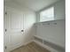 Hallway featuring built-in shelving and a door at 3218 21St N St, St Petersburg, FL 33713