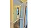 Entryway featuring slate floors and a hallway leading to other parts of the home at 4231 Tamargo Dr # 3, New Port Richey, FL 34652