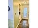 Inviting entryway featuring slate floors and a door with built-in blinds for natural light at 4231 Tamargo Dr # 3, New Port Richey, FL 34652
