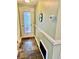 Bright entryway featuring slate floors, door with built-in blinds and trimmed walls at 4231 Tamargo Dr # 3, New Port Richey, FL 34652