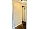 Hallway with slate flooring and neutral walls leads to various rooms in the home at 4231 Tamargo Dr # 3, New Port Richey, FL 34652
