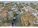 Breathtaking aerial view of waterfront homes with private docks along a serene canal leading to the open bay at 4829 W San Miguel St, Tampa, FL 33629