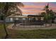 Private backyard oasis featuring a fenced pool and a covered patio for entertaining, all surrounded by tropical greenery at 4829 W San Miguel St, Tampa, FL 33629