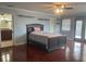 Spacious main bedroom features wood floors, transom windows, and ensuite bathroom access at 783 Placido Ne Way, St Petersburg, FL 33704