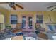 Inviting porch area with cozy chairs, outdoor furniture, and views of the lush surroundings at 783 Placido Ne Way, St Petersburg, FL 33704