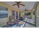 Beautiful porch area with chairs, a mosaic table, and scenic views at 783 Placido Ne Way, St Petersburg, FL 33704