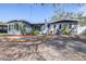Charming single-story home featuring a well-maintained lawn, landscaping, and a welcoming front entrance at 9465 50Th N Way, Pinellas Park, FL 33782