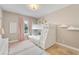 Cozy bedroom with a bunk bed, soft pink accents, and plenty of natural light at 1024 Sonata Ln, Apollo Beach, FL 33572