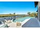Inviting pool with waterfront views and plenty of space for outdoor entertaining at 1024 Sonata Ln, Apollo Beach, FL 33572