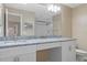 Bright bathroom with a double sink vanity, granite countertop, and walk-in shower with glass door at 1628 Baker Rd, Lutz, FL 33559