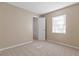 Neutral bedroom with carpet floors, window, closet and plenty of space at 1628 Baker Rd, Lutz, FL 33559
