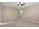 Empty bedroom featuring carpet floors and ceiling fan at 1628 Baker Rd, Lutz, FL 33559