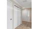 Hallway with coat closet and a door to the outside at 1628 Baker Rd, Lutz, FL 33559