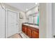 Bathroom features double sinks, wood cabinets, tile flooring, and a walk-in shower at 17102 Yellow Pine St, Wimauma, FL 33598