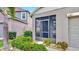 Inviting screened-in front porch with manicured landscaping and an address marker, a great curb appeal at 17102 Yellow Pine St, Wimauma, FL 33598